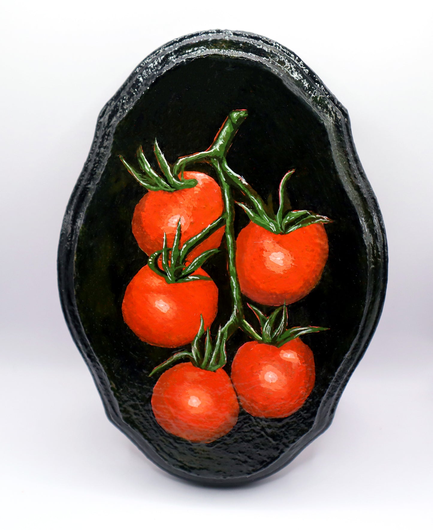 a small painting of a vine of 5 tomatoes